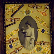 Cover image of [Wedding portrait framed with 23 cigar wrappers]